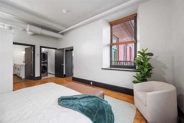 3080 Smallman St, Downtown Pgh, PA 15201 - bedroom featuring stacked washer and clothes dryer and wood finished floors