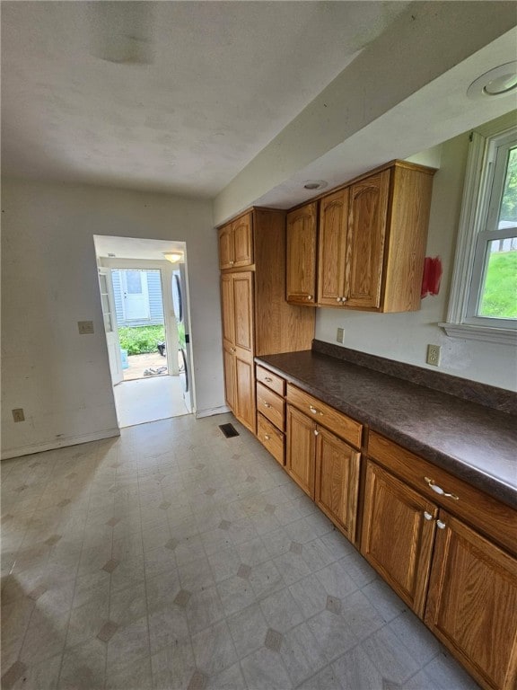 120 Upper Clinton St, Canoe/Banks Twps, PA 15772 - kitchen with brown cabinets, dark countertops, and light floors