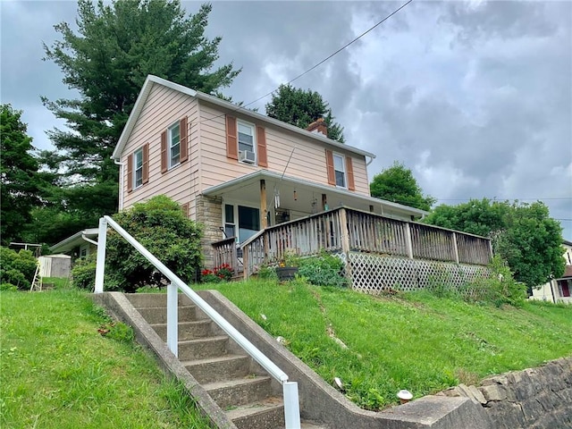 120 Upper Clinton St, Canoe/Banks Twps, PA 15772 - view of front facade with a chimney, cooling unit, a front yard, and stairway