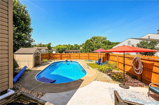 221 Wheatfield Dr, Hempfield Twp, PA 15601 - view of swimming pool with a storage unit, a patio, and a fenced backyard
