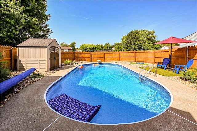221 Wheatfield Dr, Hempfield Twp, PA 15601 - view of pool with a storage shed, a fenced backyard, and a patio area