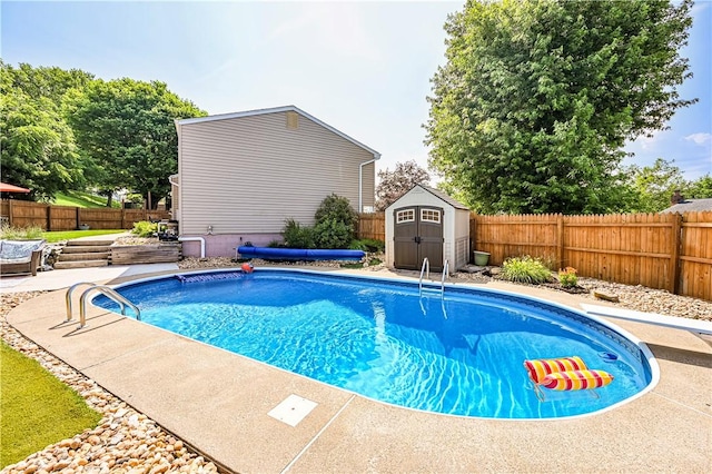 221 Wheatfield Dr, Hempfield Twp, PA 15601 - view of swimming pool featuring a storage shed, a diving board, and a fenced backyard