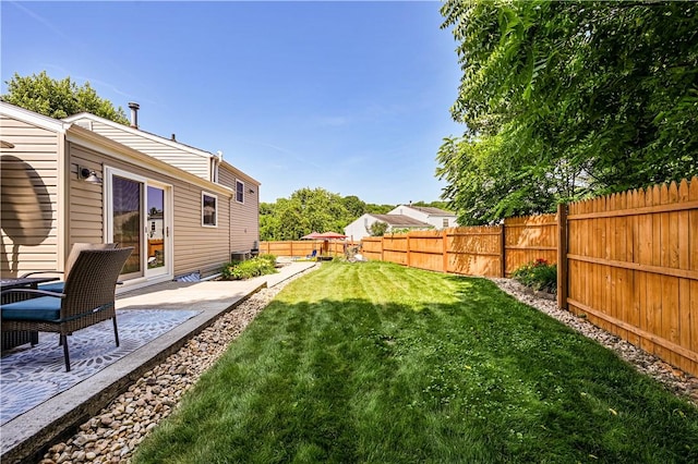 221 Wheatfield Dr, Hempfield Twp, PA 15601 - fenced backyard with a patio area