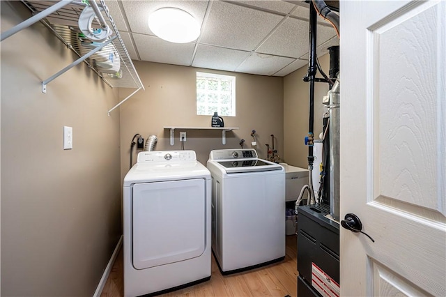 221 Wheatfield Dr, Hempfield Twp, PA 15601 - washroom featuring separate washer and dryer and light wood-type flooring