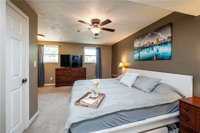 221 Wheatfield Dr, Hempfield Twp, PA 15601 - carpeted bedroom with a ceiling fan and a textured ceiling