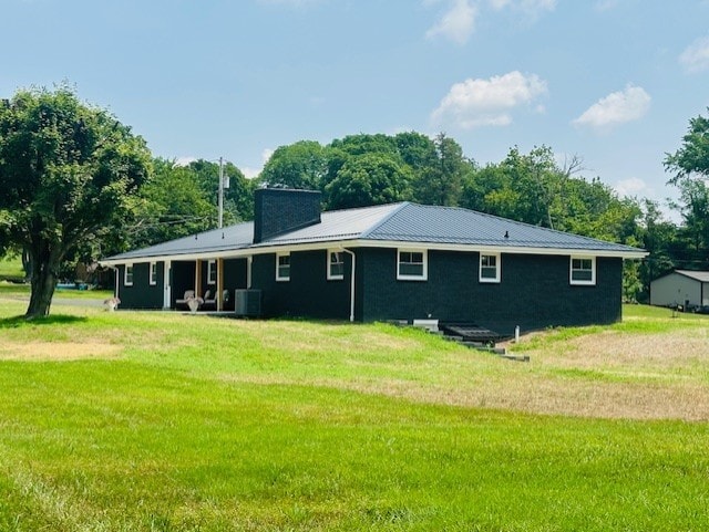 7 Indian Ln, Perry Twp, PA 15486 - rear view of house featuring a yard and a metal roof