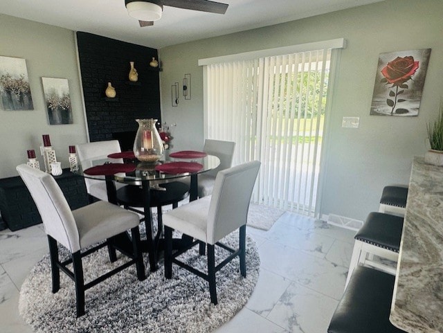 7 Indian Ln, Perry Twp, PA 15486 - dining space with marble look tile flooring and ceiling fan