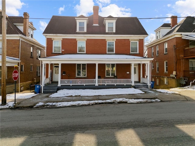 432-434 E Chestnut St E, Washington Boro, PA 15301 - townhome / multi-family property featuring brick siding, a chimney, and covered porch