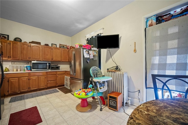 432-434 E Chestnut St E, Washington Boro, PA 15301 - kitchen featuring radiator, appliances with stainless steel finishes, brown cabinetry, and light countertops