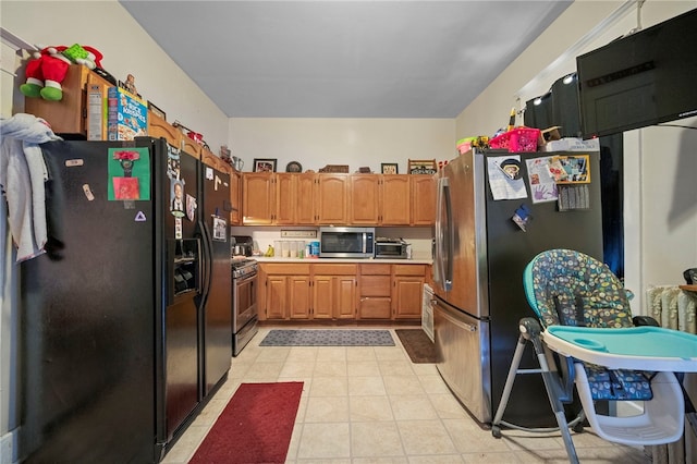 432-434 E Chestnut St E, Washington Boro, PA 15301 - kitchen featuring appliances with stainless steel finishes, light countertops, light tile patterned floors, and brown cabinets