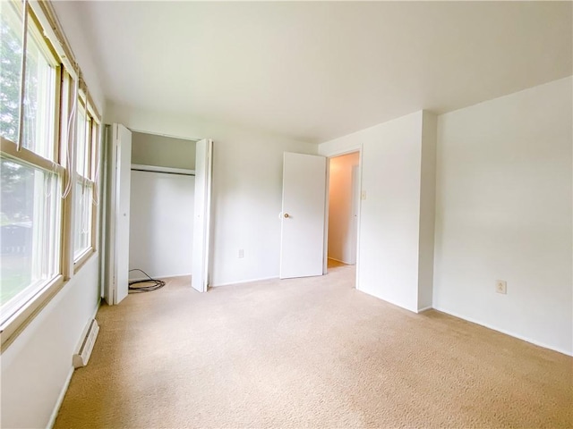5380 Tuscarawas Rd, Brighton Twp, PA 15009 - unfurnished bedroom with baseboard heating, light colored carpet, and a closet