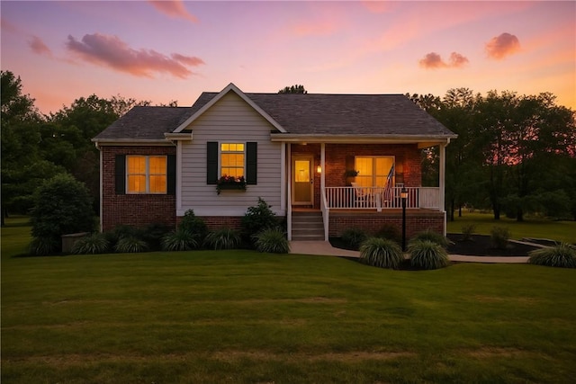 202 Ringneck Meadow Dr, Worth Twp, PA 16057 - view of front of home featuring a front yard, a porch, and brick siding
