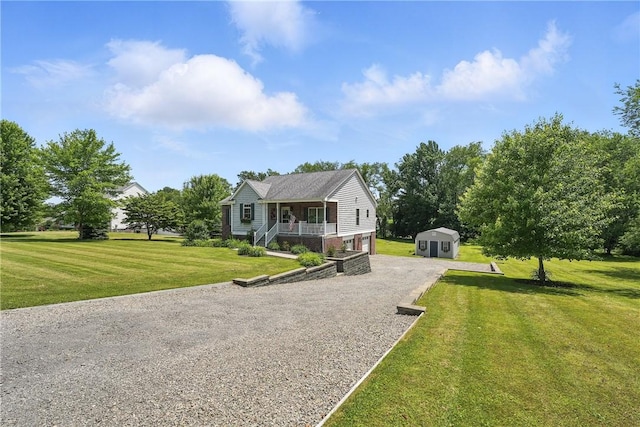 202 Ringneck Meadow Dr, Worth Twp, PA 16057 - view of front of house with covered porch, driveway, a front yard, and a storage unit