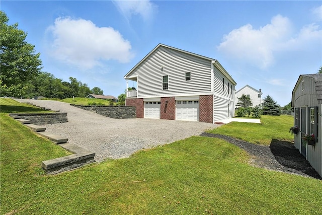 202 Ringneck Meadow Dr, Worth Twp, PA 16057 - view of property exterior featuring gravel driveway, a garage, a yard, and brick siding