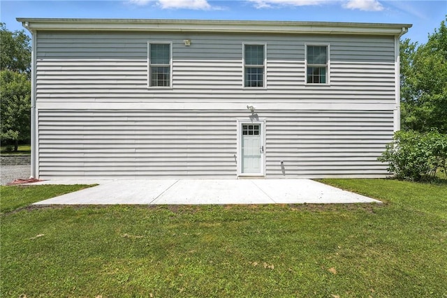 202 Ringneck Meadow Dr, Worth Twp, PA 16057 - back of property featuring a lawn and a patio area