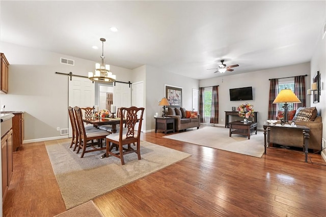 202 Ringneck Meadow Dr, Worth Twp, PA 16057 - dining space with a barn door, ceiling fan, light wood-style floors, and recessed lighting