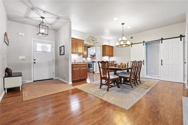 202 Ringneck Meadow Dr, Worth Twp, PA 16057 - dining area featuring a barn door, a chandelier, wood finished floors, and recessed lighting