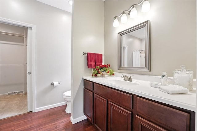 202 Ringneck Meadow Dr, Worth Twp, PA 16057 - bathroom featuring vanity, wood finished floors, and a spacious closet