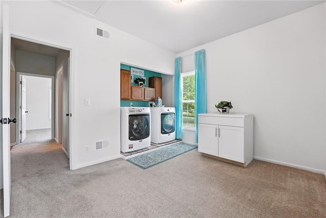 202 Ringneck Meadow Dr, Worth Twp, PA 16057 - laundry room featuring cabinet space, separate washer and dryer, and light colored carpet