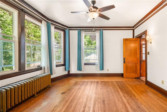 429 S Center Ave, Somerset Boro, PA 15501 - unfurnished room featuring radiator heating unit, light wood-style flooring, crown molding, and ceiling fan