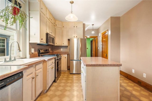 429 S Center Ave, Somerset Boro, PA 15501 - kitchen with stainless steel appliances, light floors, light countertops, a kitchen island, and decorative light fixtures