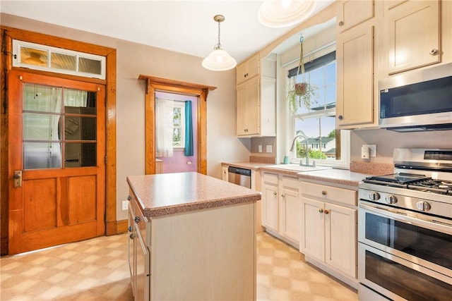 429 S Center Ave, Somerset Boro, PA 15501 - kitchen with light floors, appliances with stainless steel finishes, light countertops, a kitchen island, and hanging light fixtures