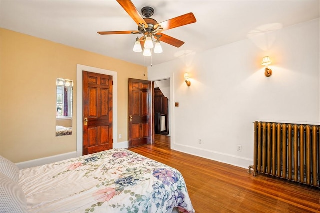 429 S Center Ave, Somerset Boro, PA 15501 - bedroom featuring radiator, wood finished floors, and a ceiling fan