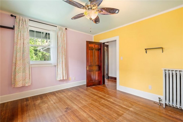 429 S Center Ave, Somerset Boro, PA 15501 - empty room featuring radiator, wood finished floors, ceiling fan, and crown molding