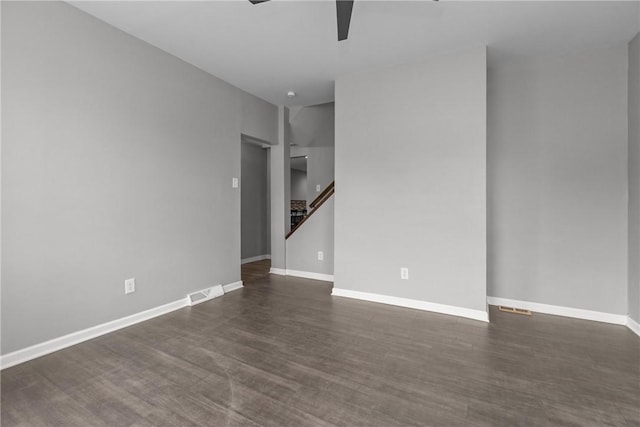 1022 2nd Ave, Coraopolis, PA 15108 - empty room featuring a ceiling fan, stairway, and dark wood finished floors