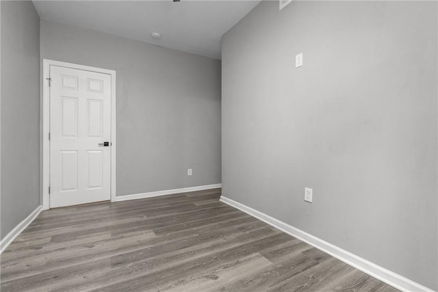 1022 2nd Ave, Coraopolis, PA 15108 - empty room with wood finished floors and a smoke detector