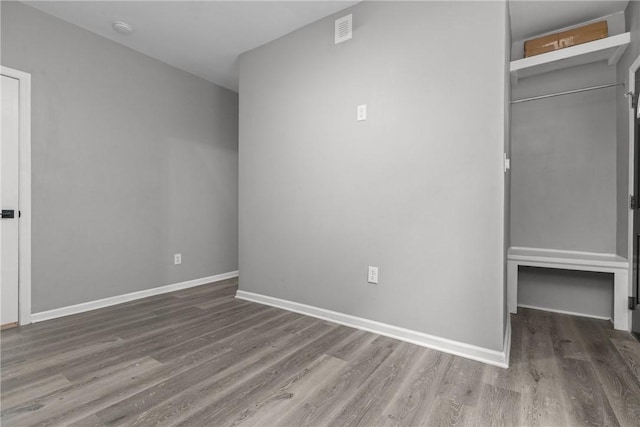 1022 2nd Ave, Coraopolis, PA 15108 - unfurnished bedroom with wood finished floors and baseboards