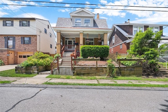 310 Columbia Ave, West View, PA 15229 - bungalow-style home with a porch, stairs, a garage, concrete driveway, and roof with shingles