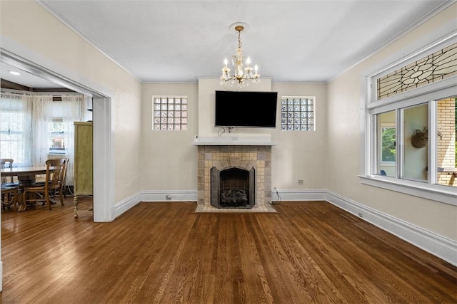 310 Columbia Ave, West View, PA 15229 - unfurnished living room featuring wood finished floors, crown molding, a chandelier, and a fireplace with flush hearth