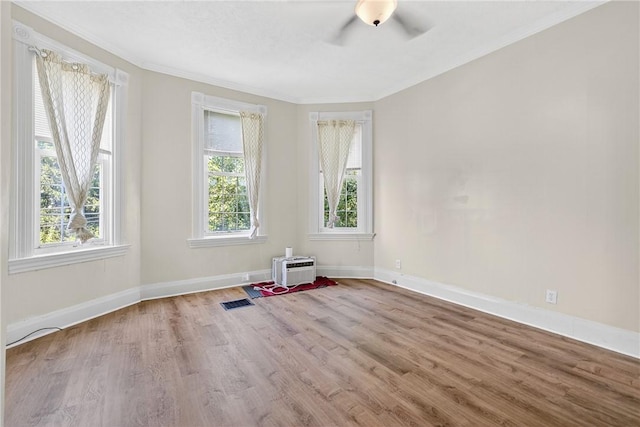 201 La Belle St, Mt Washington, PA 15211 - spare room with crown molding, ceiling fan, wood finished floors, and a wall mounted AC