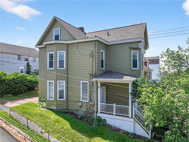 201 La Belle St, Mt Washington, PA 15211 - back of property featuring roof with shingles and a yard