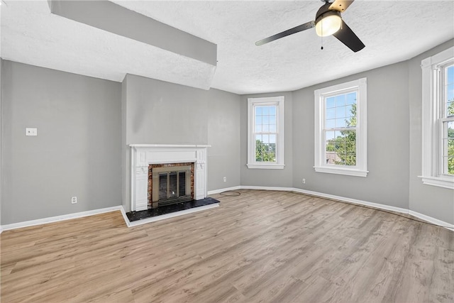 201 La Belle St, Mt Washington, PA 15211 - unfurnished living room featuring a textured ceiling, wood finished floors, ceiling fan, and a fireplace