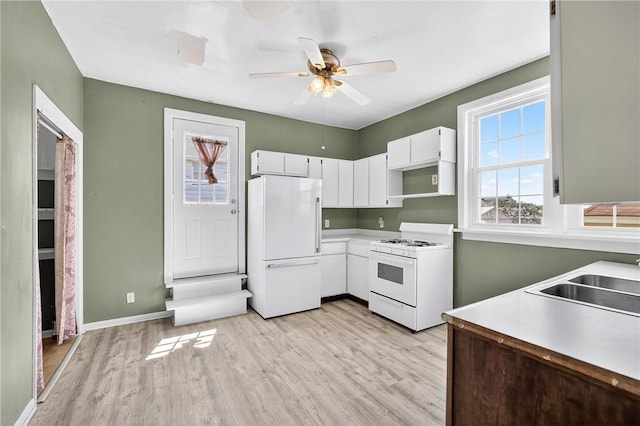 201 La Belle St, Mt Washington, PA 15211 - kitchen featuring white appliances, light wood-type flooring, white cabinetry, and light countertops