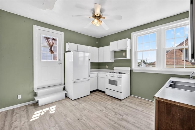 201 La Belle St, Mt Washington, PA 15211 - kitchen featuring white appliances, a ceiling fan, light wood-style flooring, white cabinets, and light countertops