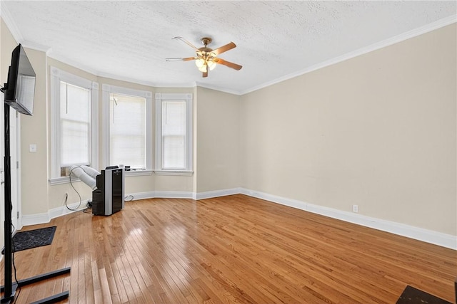 201 La Belle St, Mt Washington, PA 15211 - unfurnished living room with light wood-style floors, a ceiling fan, a textured ceiling, and crown molding