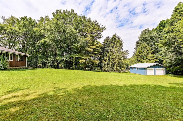 483 Twin Lakes Rd, Unity Twp, PA 15650 - view of green lawn featuring a garage and an outbuilding