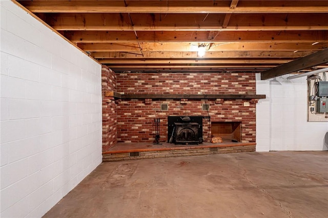 483 Twin Lakes Rd, Unity Twp, PA 15650 - unfinished below grade area with a wood stove and electric panel