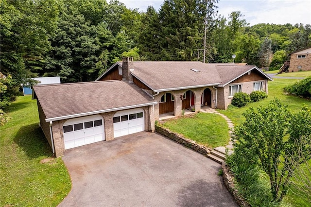 483 Twin Lakes Rd, Unity Twp, PA 15650 - single story home featuring driveway, a front lawn, an attached garage, and covered porch