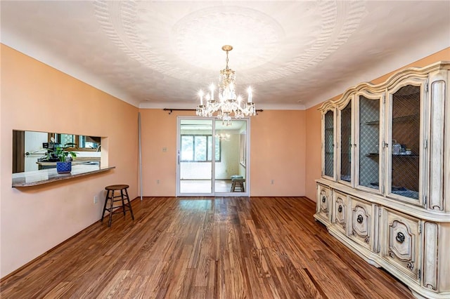 483 Twin Lakes Rd, Unity Twp, PA 15650 - empty room with wood finished floors and a chandelier