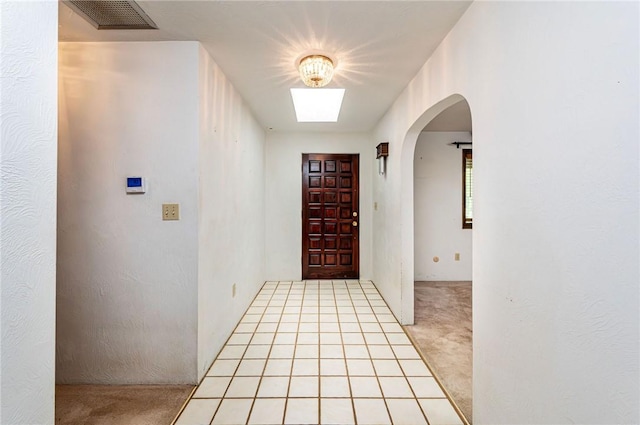 483 Twin Lakes Rd, Unity Twp, PA 15650 - foyer entrance with arched walkways and light carpet