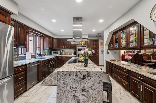 633 Westminster Rd, Hermitage, PA 16148 - kitchen with stainless steel appliances, island exhaust hood, light marble finish flooring, a center island, and recessed lighting