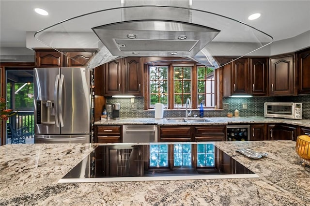 633 Westminster Rd, Hermitage, PA 16148 - kitchen with appliances with stainless steel finishes, light stone counters, wine cooler, tasteful backsplash, and recessed lighting