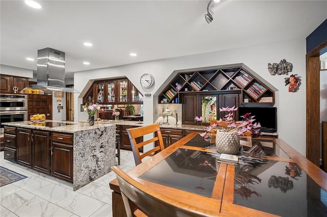 633 Westminster Rd, Hermitage, PA 16148 - kitchen with stainless steel double oven, black electric cooktop, dark brown cabinets, light marble finish floors, and recessed lighting