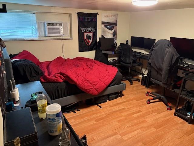 3141 Beechwood Blvd, Squirrel Hill, PA 15217 - bedroom featuring light wood-style flooring, a desk, and a wall unit AC