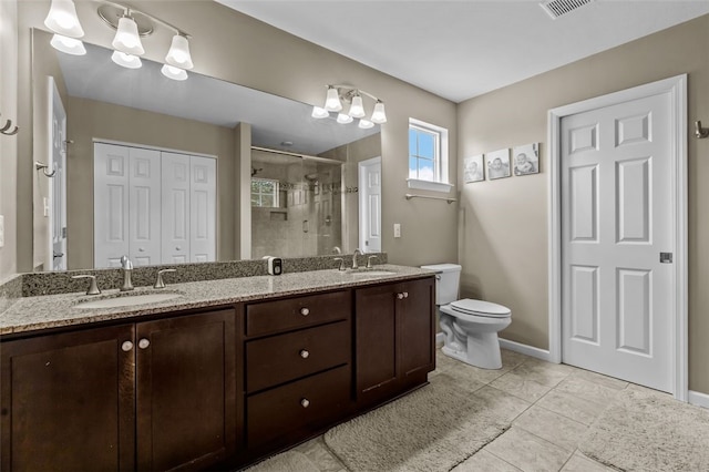 294 Connoquenessing Main St, Connoquenessing Boro, PA 16033 - full bath featuring a shower stall, double vanity, tile patterned floors, and a closet
