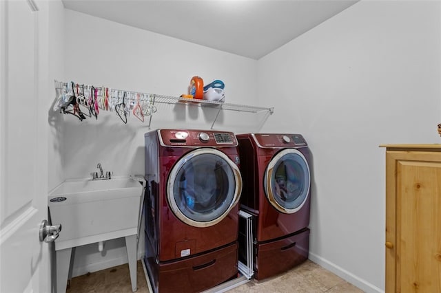 294 Connoquenessing Main St, Connoquenessing Boro, PA 16033 - laundry room featuring washer and clothes dryer and light tile patterned floors